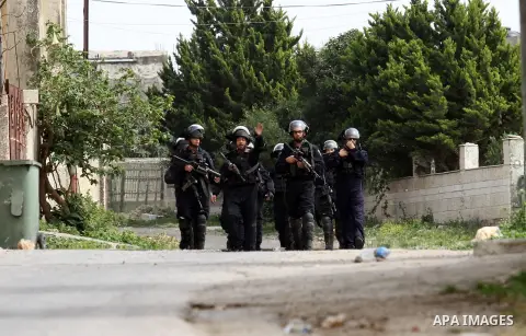Israeli security forces take position during clashes with Palestinian protesters following a demonstration against the expropriation of Palestinian land by Israel in the village of Kfar Qaddum, near Nablus, in the occupi...