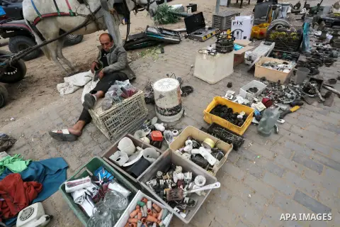 Palestinian vendors display all kinds of used goods at El-Yarmouk market in Gaza city, on March 26, 2016. Photo by Mohammed Asad