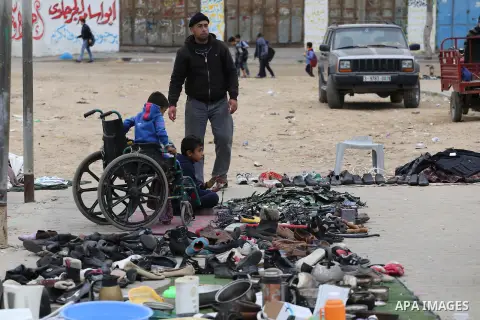 Palestinian vendors display all kinds of used goods at El-Yarmouk market in Gaza city, on March 26, 2016. Photo by Mohammed Asad