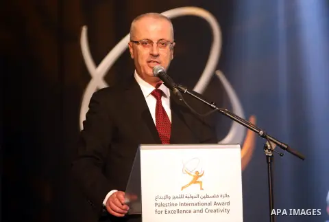 Palestinian Prime Minister Rami Hamdallah speaks during the Ceremony of Palestine International Award for Excellence and Creativity at al-Najah University, in the West Bank city of Nablus on March 29, 2016. Photo by Prim...