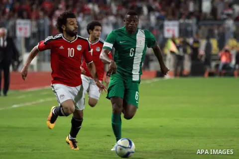 Egyptian players and Nigerian players compete during their African Cup of Nations group G qualification football match between Egypt and Nigeria at the Borg el-Arab Stadium in Alexandria on March 29, 2016. Photo by Strin...