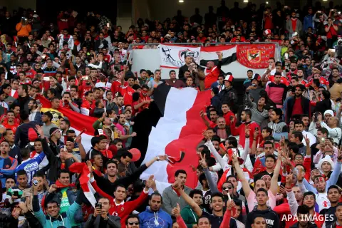 Egyptian fans watch the African Cup of Nations group G qualification football match between Egypt and Nigeria at the Borg el-Arab Stadium in Alexandria on March 29, 2016. Photo by Stringer
