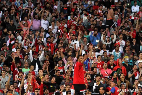 Egyptian fans watch the African Cup of Nations group G qualification football match between Egypt and Nigeria at the Borg el-Arab Stadium in Alexandria on March 29, 2016. Photo by Stringer