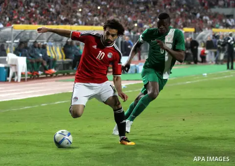 Egyptian players and Nigerian players compete during their African Cup of Nations group G qualification football match between Egypt and Nigeria at the Borg el-Arab Stadium in Alexandria on March 29, 2016. Photo by Strin...