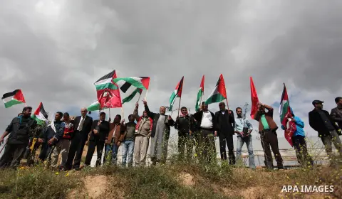 Demonstrators holding Palestinian flags chant slogans during a rally marking Land Day, near the Israeli border with central Gaza Strip March 30, 2016. March 30 marks Land Day, the annual commemorations of the killing by...