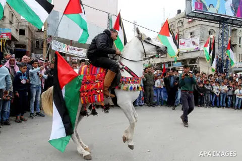A Palesitnian man rides a hourse to mark Land Day on March 30, 2016, in Khan Yunis, in the southern Gaza Strip, as Palestinians mark Land Day. March 30 marks Land Day, the annual commemorations of the killing by police o...