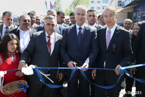 Palestinian Prime Minister, Rami Hamdallah, attends a ceremony of distribution of waste trucks, in the West Bank city of Ramallah, on April 7, 2016. Photo by Prime Minister Office