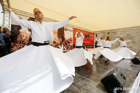Whirling dervishes perform during a festival at the mosque of Nabi Musa, where the tomb of Prophet Moses is believed to be placed, in the Judean Desert neat the West Bank town of Jericho, on April 8, 2016. The festival s...