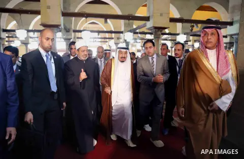 A handout picture made available by al-Azhar media center on April 9, 2016 shows the Grand Imam of al-Azhar Sheikh Ahmed al-Tayeb and Saudi King Salman bin Abdulaziz visiting the mosque at al-Azhar headquarters, the most...
