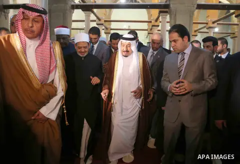 A handout picture made available by al-Azhar media center on April 9, 2016 shows the Grand Imam of al-Azhar Sheikh Ahmed al-Tayeb and Saudi King Salman bin Abdulaziz visiting the mosque at al-Azhar headquarters, the most...