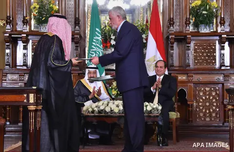 A handout picture released by the Egyptian Presidency on April 10, 2016 shows Egyptian President Abdel Fattah al-Sisi meeting with Saudi King Salman bin Abdulaziz as part of a signing ceremony for bilateral aggrements at...