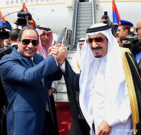 Saudi King Salman shake hands with Egyptian President Abdel Fattah al-Sisi before leaving Cairo's international airport on April 11, 2016. Photo by Egyptian President Office