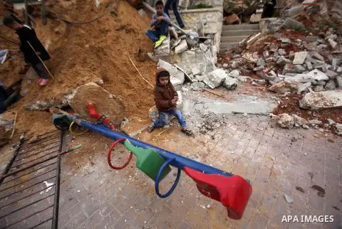 Palestinian children inspect the damage to a children's garden after it was demolished by Israeli troops in the village of Za'tara near the West Bank city of Nablus, Tuesday, April 12, 2016. Israeli forces demolished the...