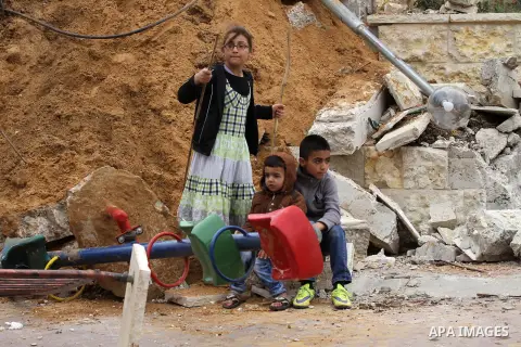 Palestinian children inspect the damage to a children's garden after it was demolished by Israeli troops in the village of Za'tara near the West Bank city of Nablus, Tuesday, April 12, 2016. Israeli forces demolished the...