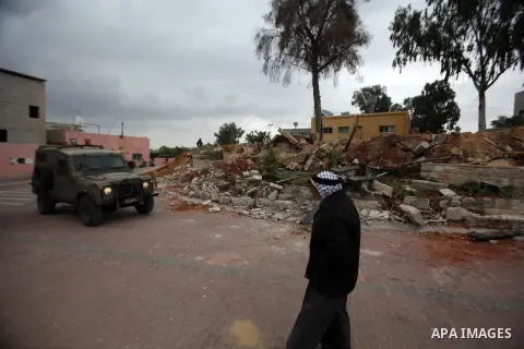 A Palestinian man inspects the damage to a children's garden after it was demolished by Israeli troops in the village of Za'tara near the West Bank city of Nablus, Tuesday, April 12, 2016. Israeli forces demolished the c...