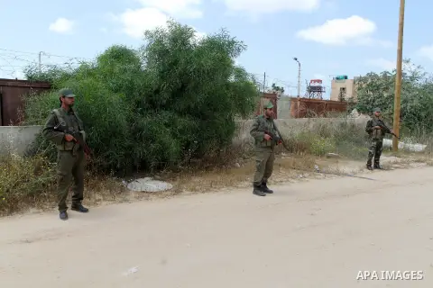 Members of Palestinian security forces stand guard in front of the Gaza-Egypt border in Rafah in the southern Gaza Strip, on April 14, 2016. Senior Hamas leader Ismail Haniyeh confirmed that Hamas spares no measures to p...