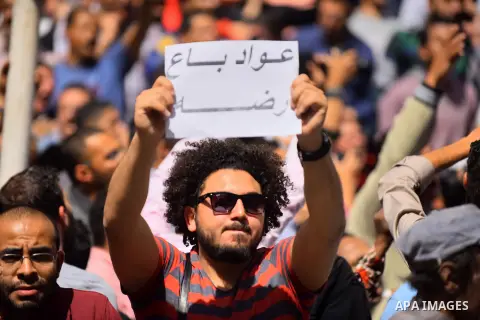 Egyptian activists shout slogans against President Abdel Fattah al-Sisi and his government, during a demonstration protesting the government's decision to transfer two Red Sea islands to Saudi Arabia, in front of the Pre...