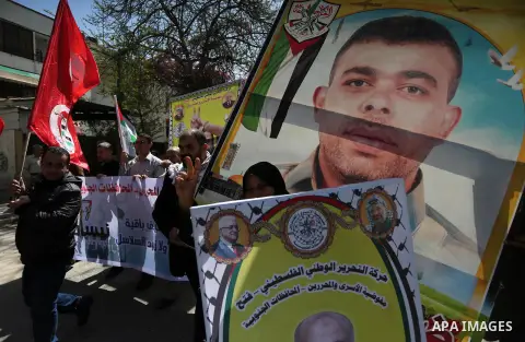Palestinians take part during a rally marking Palestinian Prisoner Day in Gaza City on April 17, 2016. Photo by Mohammed Asad