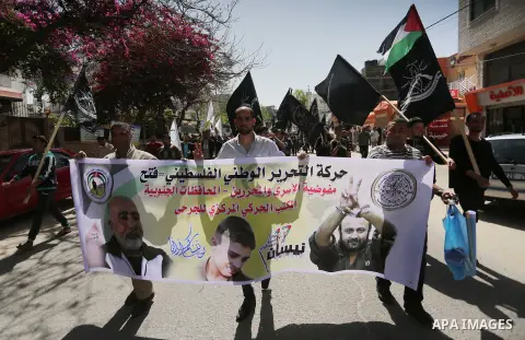 Palestinians take part during a rally marking Palestinian Prisoner Day in Gaza City on April 17, 2016. Photo by Mohammed Asad
