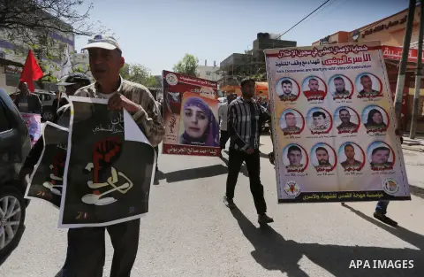 Palestinians take part during a rally marking Palestinian Prisoner Day in Gaza City on April 17, 2016. Photo by Mohammed Asad