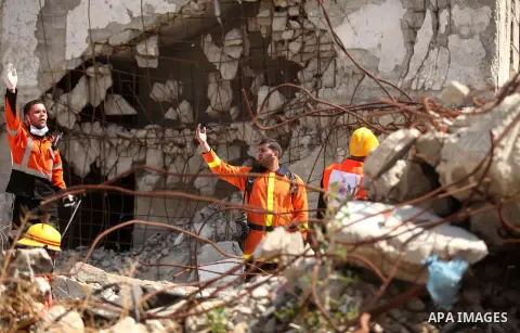 Palestinian emergency personnel take part in a drill in a building which was destroyed during the 50-day war between Israel and Hamas militants in the summer of 2014, in Gaza City, on April 19, 2016. Photo by Ashraf Amra