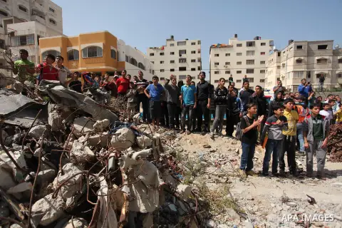 Palestinian emergency personnel take part in a drill in a building which was destroyed during the 50-day war between Israel and Hamas militants in the summer of 2014, in Gaza City, on April 19, 2016. Photo by Ashraf Amra