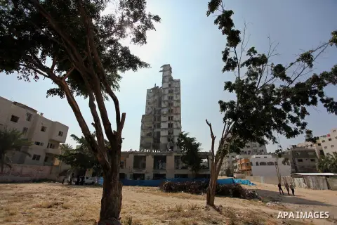 Palestinian emergency personnel take part in a drill in a building which was destroyed during the 50-day war between Israel and Hamas militants in the summer of 2014, in Gaza City, on April 19, 2016. Photo by Ashraf Amra