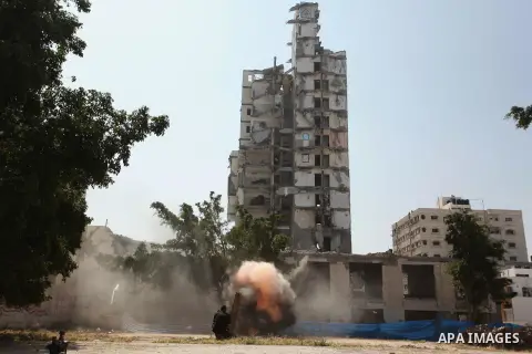 Palestinian emergency personnel take part in a drill in a building which was destroyed during the 50-day war between Israel and Hamas militants in the summer of 2014, in Gaza City, on April 19, 2016. Photo by Ashraf Amra