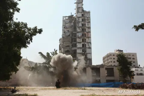 Palestinian emergency personnel take part in a drill in a building which was destroyed during the 50-day war between Israel and Hamas militants in the summer of 2014, in Gaza City, on April 19, 2016. Photo by Ashraf Amra