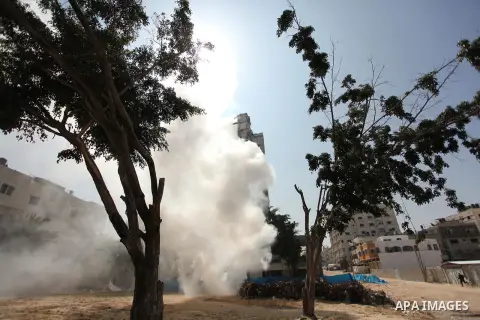 Palestinian emergency personnel take part in a drill in a building which was destroyed during the 50-day war between Israel and Hamas militants in the summer of 2014, in Gaza City, on April 19, 2016. Photo by Ashraf Amra