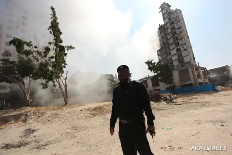 Palestinian emergency personnel take part in a drill in a building which was destroyed during the 50-day war between Israel and Hamas militants in the summer of 2014, in Gaza City, on April 19, 2016. Photo by Ashraf Amra