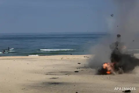 Palestinian emergency personnel take part in a drill ,at the beach of the Mediterranean sea on the coast of Gaza city, on April 19, 2016. Photo by Mohammed Asad