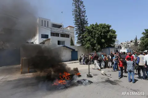 Palestinian owners of houses which were destroyed during the recent Israeli war, take part in a protest, in front of high commissioner for human rights headquarters, in Gaza City on April 20, 2016. Israeli occupation pri...