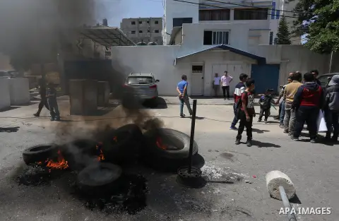 Palestinian owners of houses which were destroyed during the recent Israeli war, take part in a protest, in front of high commissioner for human rights headquarters, in Gaza City on April 20, 2016. Israeli occupation pri...