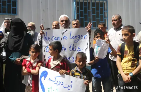 Palestinian owners of houses which were destroyed during the recent Israeli war, take part in a protest, in front of high commissioner for human rights headquarters, in Gaza City on April 20, 2016. Israeli occupation pri...