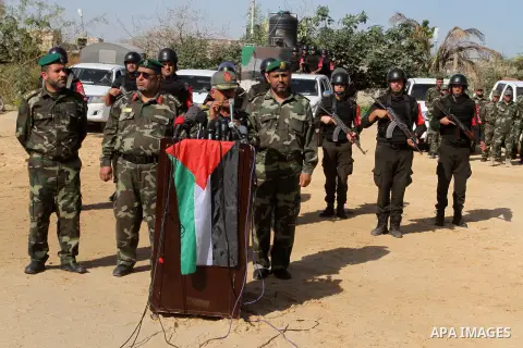 Members of Palestinian security forces loyal to Hamas stand guard as they are deployed to maintain security on the border of southern Gaza Strip with Egypt, April 21, 2016. Hamas began deploying additional forces on the...