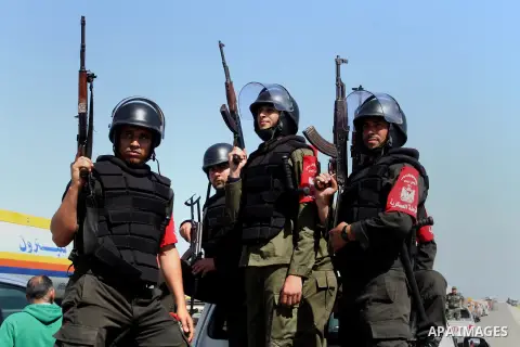 Members of Palestinian security forces loyal to Hamas ride a pickup truck as they are deployed to maintain security on the border of southern Gaza Strip with Egypt, April 21, 2016. Hamas began deploying additional forces...