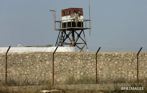 An Egyptian soldier stand on a watching tower as Members of Palestinian security forces loyal to Hamas deployed to maintain security on the border of southern Gaza Strip with Egypt, April 21, 2016. Hamas began deploying...