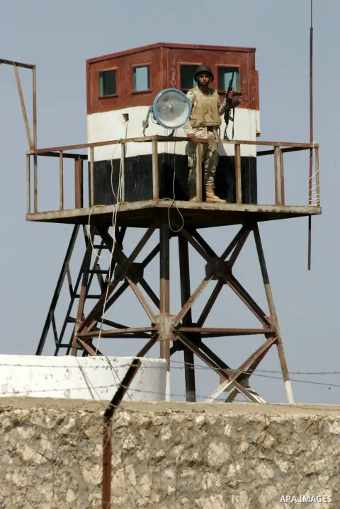 An Egyptian soldier stand on a watching tower as Members of Palestinian security forces loyal to Hamas deployed to maintain security on the border of southern Gaza Strip with Egypt, April 21, 2016. Hamas began deploying...