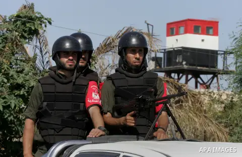 Members of Palestinian security forces loyal to Hamas ride a pickup truck as they are deployed to maintain security on the border of southern Gaza Strip with Egypt, April 21, 2016. Hamas began deploying additional forces...