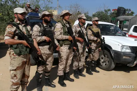 Members of Palestinian security forces loyal to Hamas stand guard as they are deployed to maintain security on the border of southern Gaza Strip with Egypt, April 21, 2016. Hamas began deploying additional forces on the...