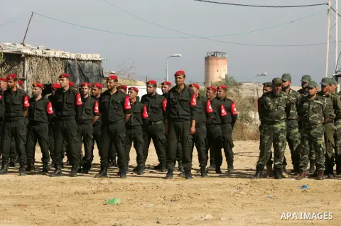 Members of Palestinian security forces loyal to Hamas salute as they are deployed to maintain security on the border of southern Gaza Strip with Egypt, April 21, 2016. Hamas began deploying additional forces on the Gaza...