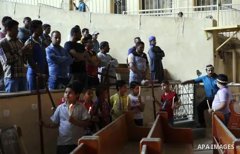Egyptian Coptic Christian attend the Palm Sunday celebrations at the Deir Samaan Church in Cairo, Egypt, Saturday, April 24, 2016. Photo by Amr Sayed