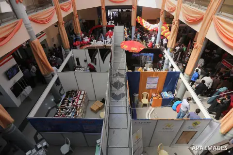 Palestinians attend exhibition for national products at Islamic University, in Gaza city, on April 24, 2016. Photo by Mohammed Asad