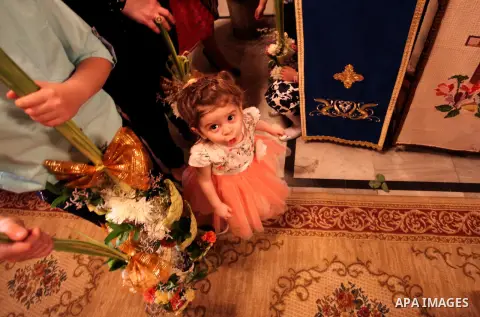 Palestinian Christians take part in the Greek Orthodox Christian Palm Sunday celebrations at St.Porphyrios Church in Gaza City, on April 24, 2016. Palm Sunday marks the triumphant return of Jesus Christ to Jerusalem when...