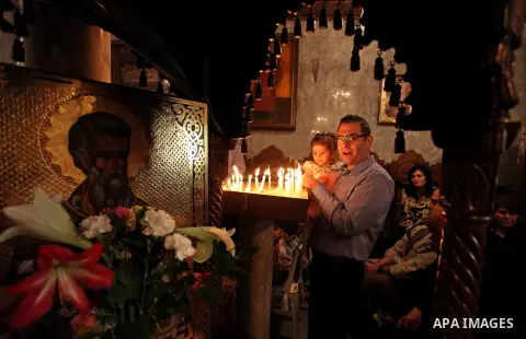 Palestinian Christians take part in the Greek Orthodox Christian Palm Sunday celebrations at St.Porphyrios Church in Gaza City, on April 24, 2016. Palm Sunday marks the triumphant return of Jesus Christ to Jerusalem when...