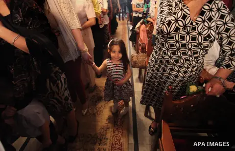 Palestinian Christians take part in the Greek Orthodox Christian Palm Sunday celebrations at St.Porphyrios Church in Gaza City, on April 24, 2016. Palm Sunday marks the triumphant return of Jesus Christ to Jerusalem when...