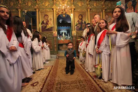 Palestinian Christians take part in the Greek Orthodox Christian Palm Sunday celebrations at St.Porphyrios Church in Gaza City, on April 24, 2016. Palm Sunday marks the triumphant return of Jesus Christ to Jerusalem when...