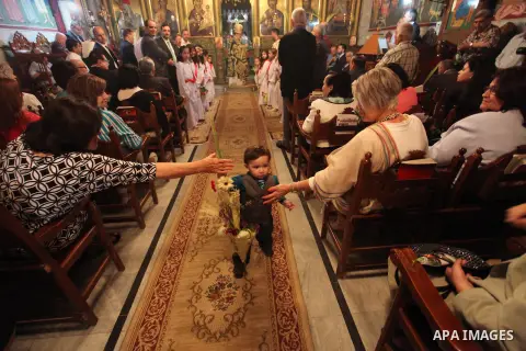 Palestinian Christians take part in the Greek Orthodox Christian Palm Sunday celebrations at St.Porphyrios Church in Gaza City, on April 24, 2016. Palm Sunday marks the triumphant return of Jesus Christ to Jerusalem when...
