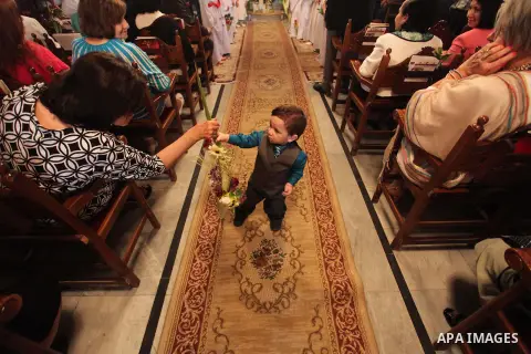 Palestinian Christians take part in the Greek Orthodox Christian Palm Sunday celebrations at St.Porphyrios Church in Gaza City, on April 24, 2016. Palm Sunday marks the triumphant return of Jesus Christ to Jerusalem when...